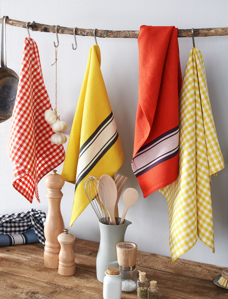 set of two organic cotton tea towels in red yellow and blue checks and stripes 