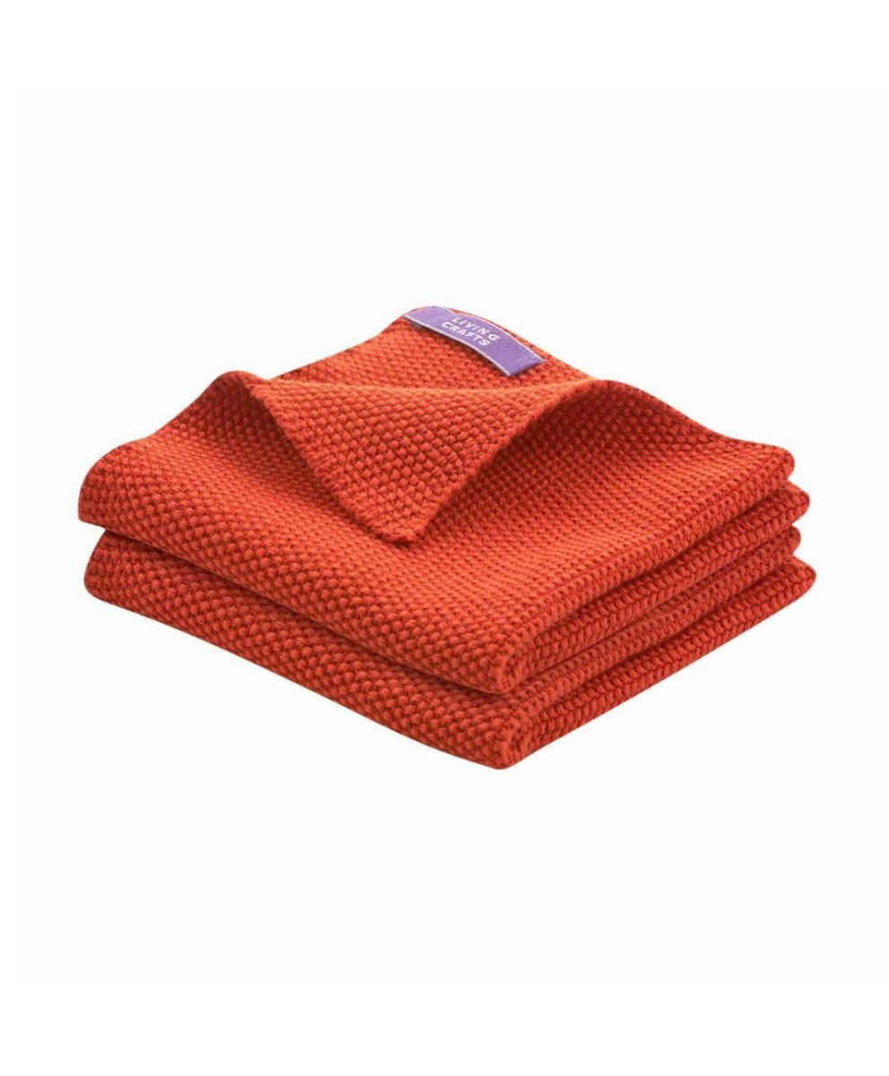 set of two organic knitted dish cloth in 3 colours turmeric yellow terracotta and natural undyed