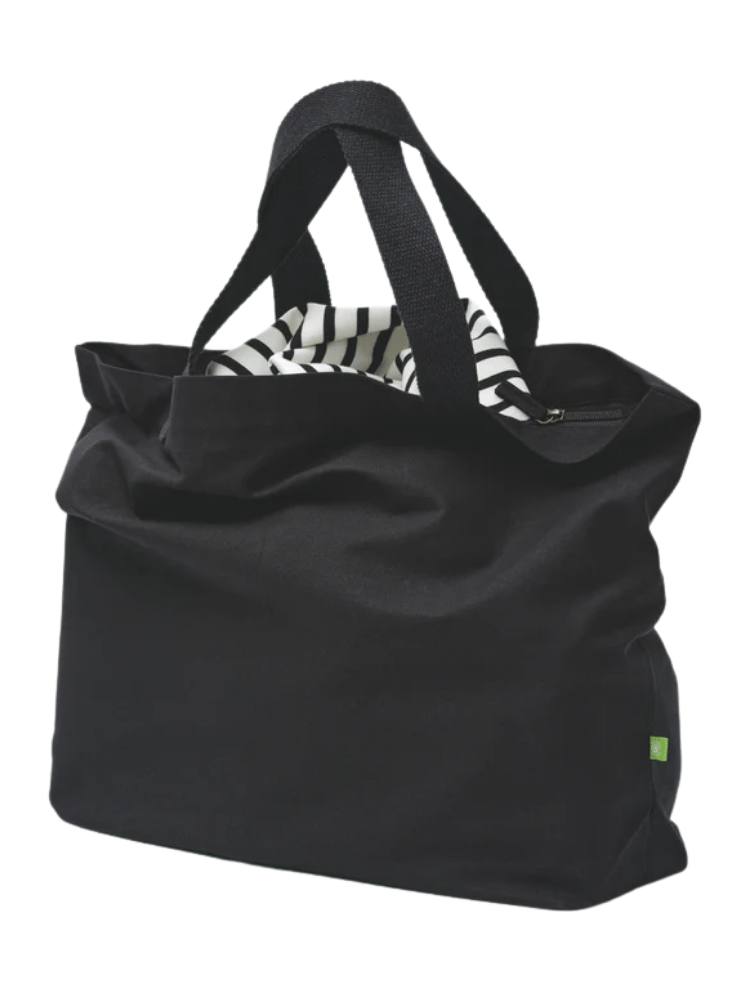 a black organic cotton zip up tote with a stripey top inside 