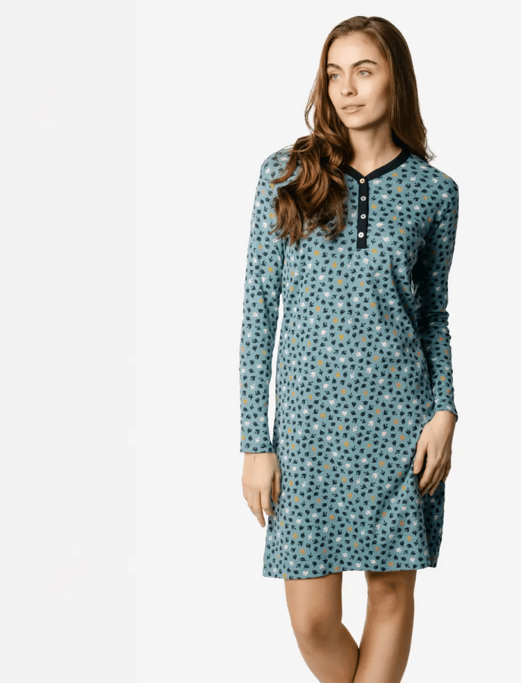 a woman is wearing a long sleeve light blue bird print organic cotton nightshirt