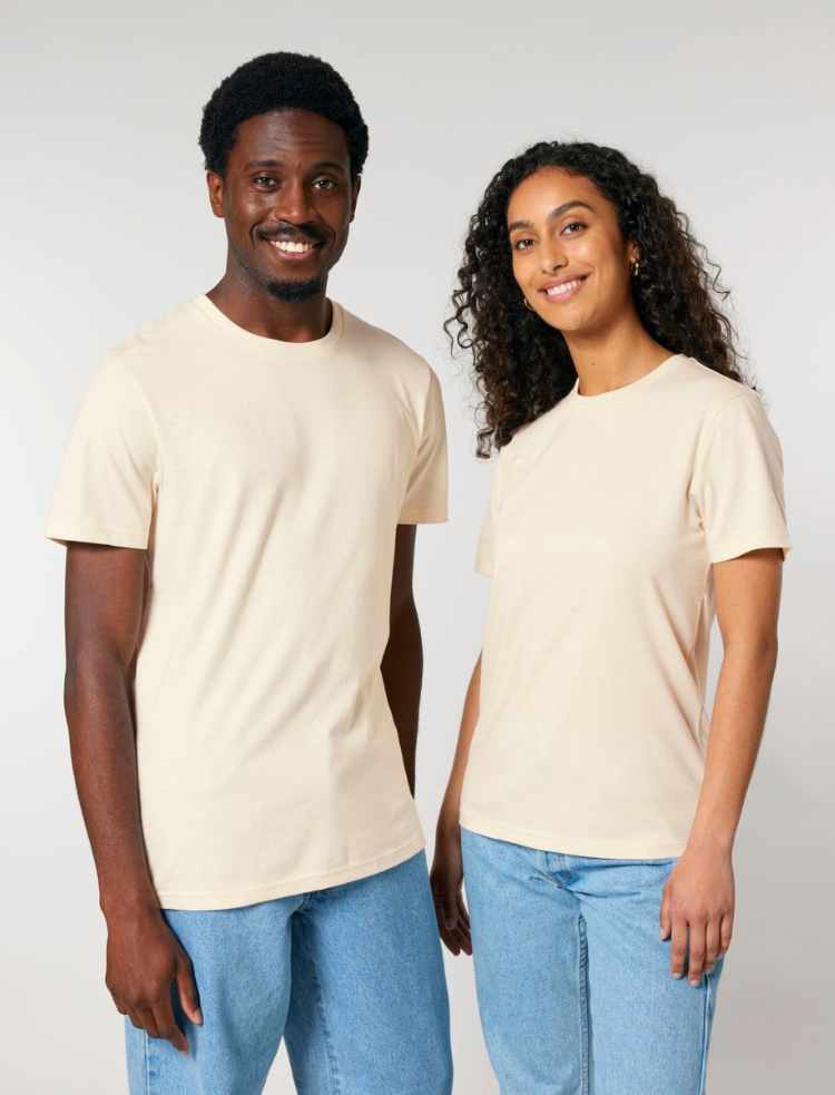 A woman is wearing organic cotton mulberry coloured t-shirt with her hand on her hip 