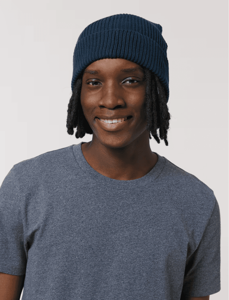 a man wearing an organic cotton beanie in french navy
