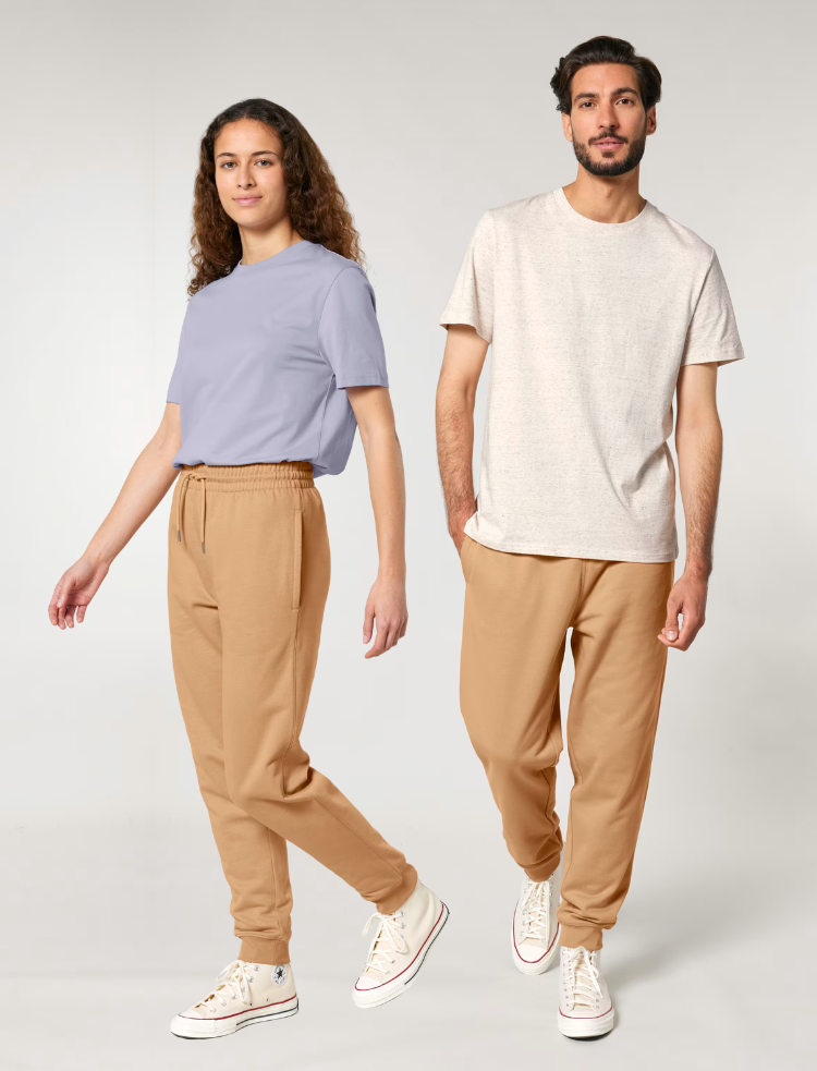 a man and a woman are wearing latte coloured organic cotton joggers