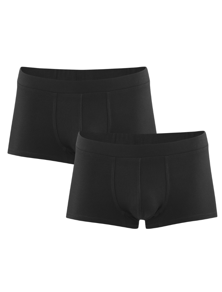 a man wearing an organic v-neck t-shirt and organic black trunks 