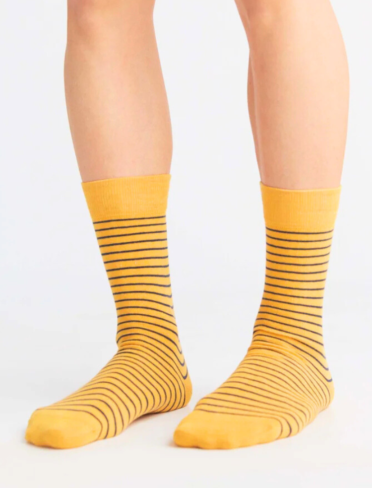 red, white and blue stripe organic cotton socks on a grey background