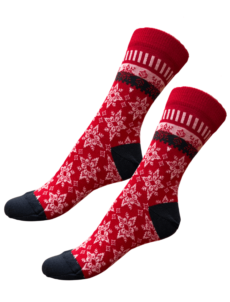 organic wool and cotton socks, red with nordic style snowflake design and black toe and heel lying flat on a white background 