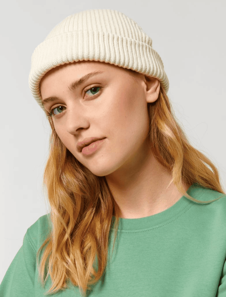 a man wearing an organic cotton beanie in french navy
