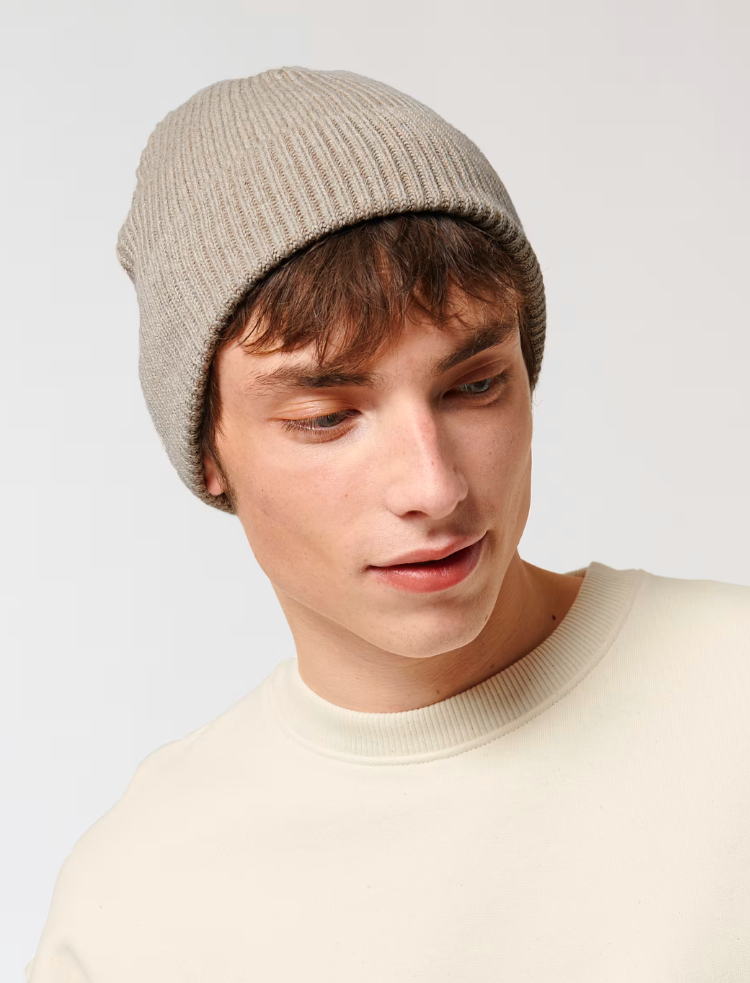 a man wearing an organic cotton rib beanie in oatmeal