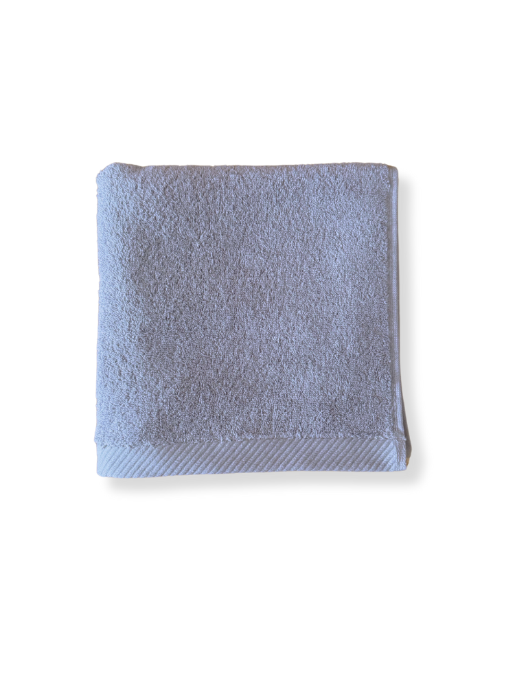 soft grey organic cotton hand towel folded into a square 