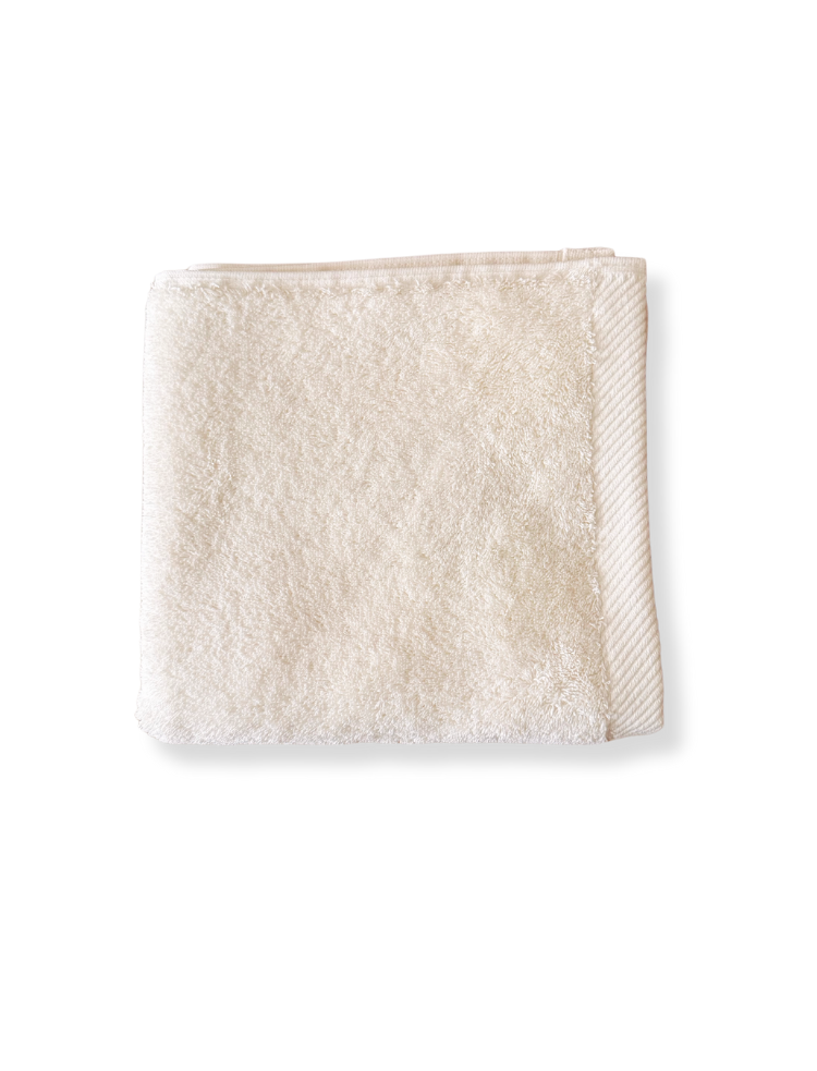 soft grey organic cotton hand towel folded into a square 