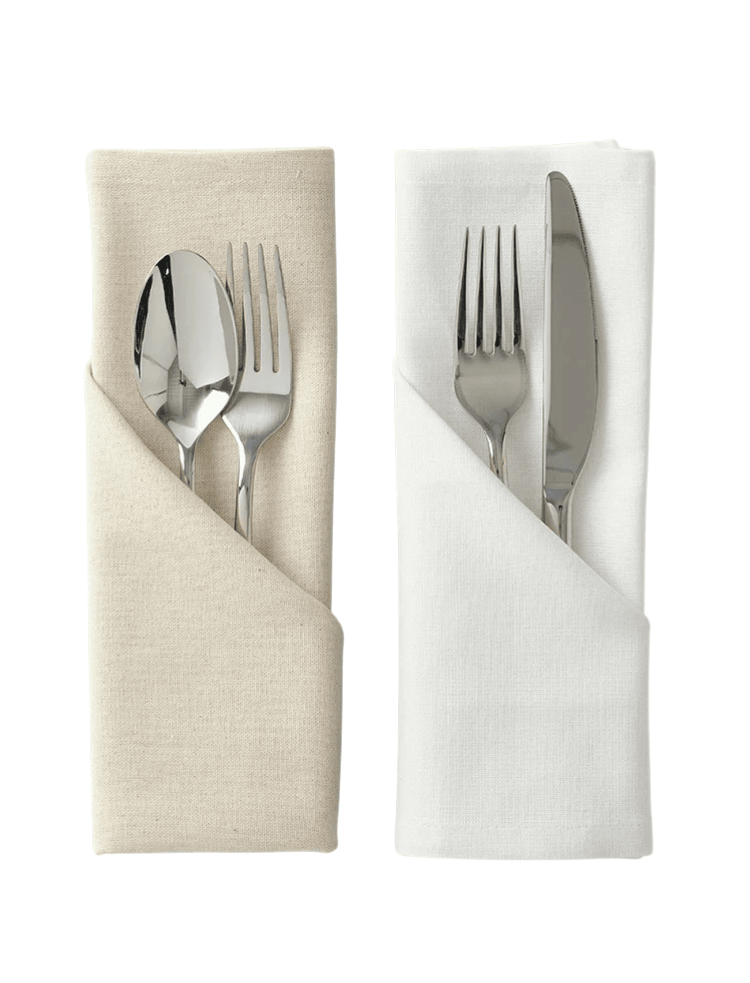 cutlery wrapped up in a white organic napkin, and a natural colour organic cotton napkin.