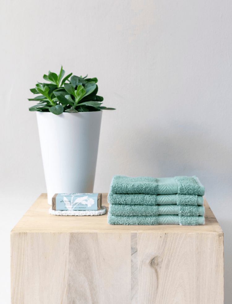 organic cotton flannel mint green face cloth, folded into a square on a white background
