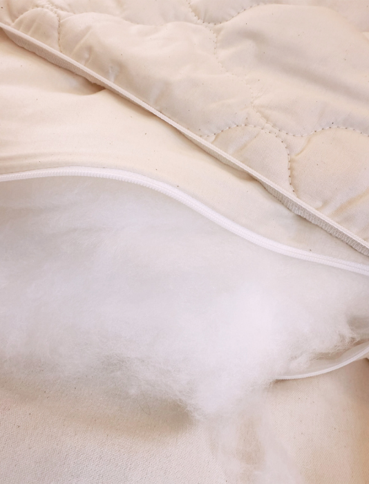 A tencel filled pillow with a quilted organic cotton and tencel case. plus an insert showing a close up of tencel fibres.