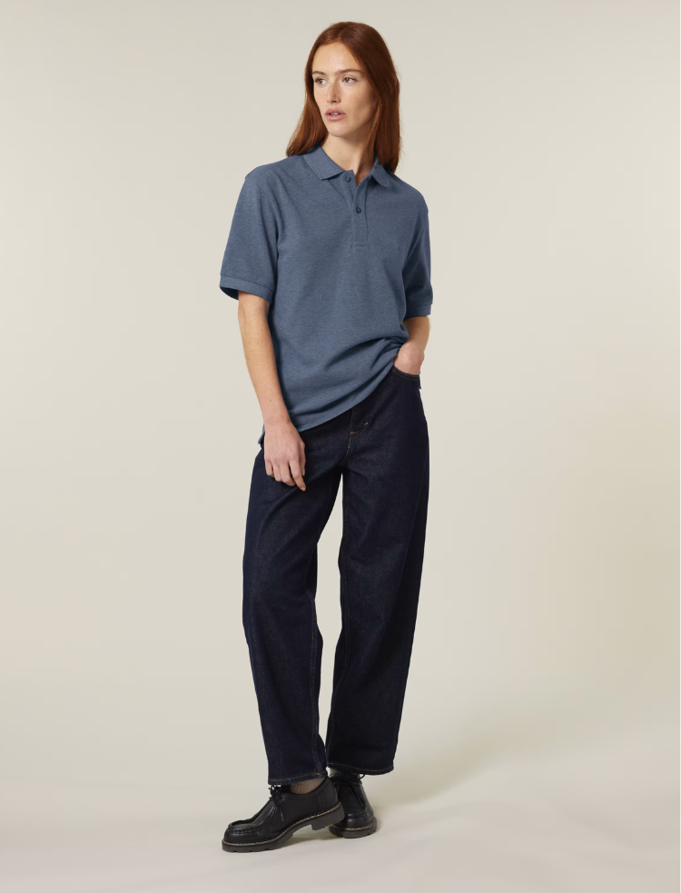 A man is wearing a blue heather organic cotton polo shirt 