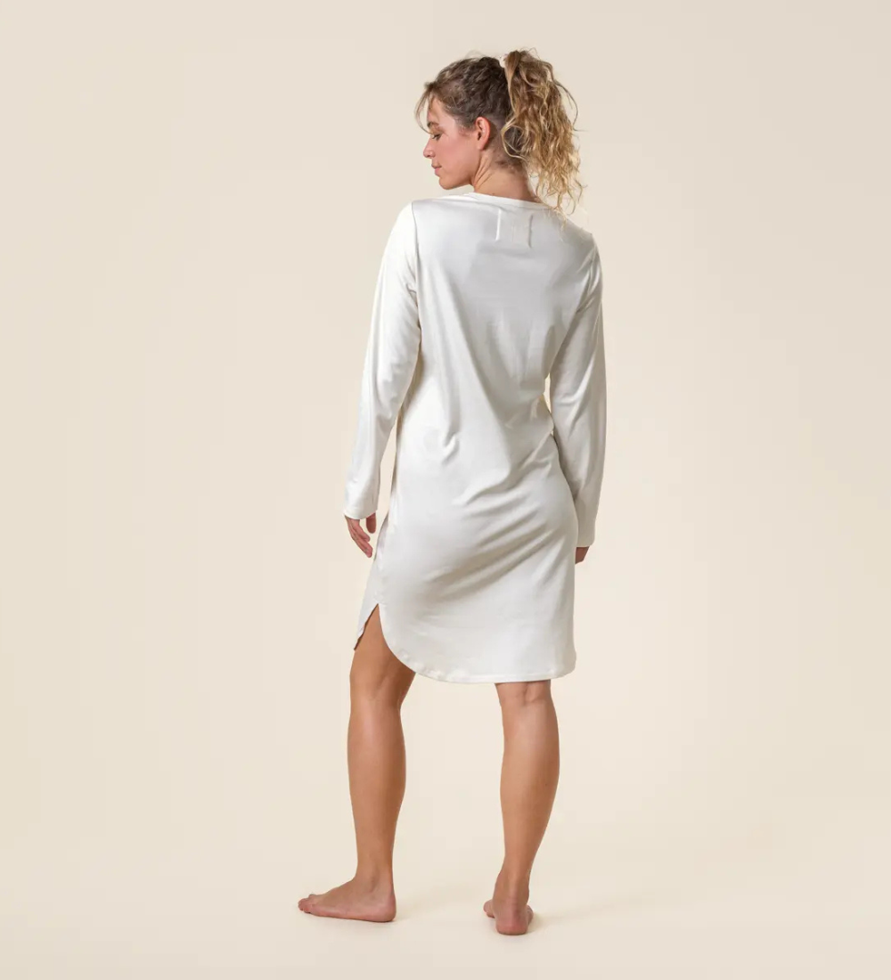 a woman is wearing a natural undyed organic cotton nighshirts