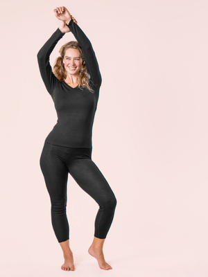 a woman wearing black organic cotton and silk base layers