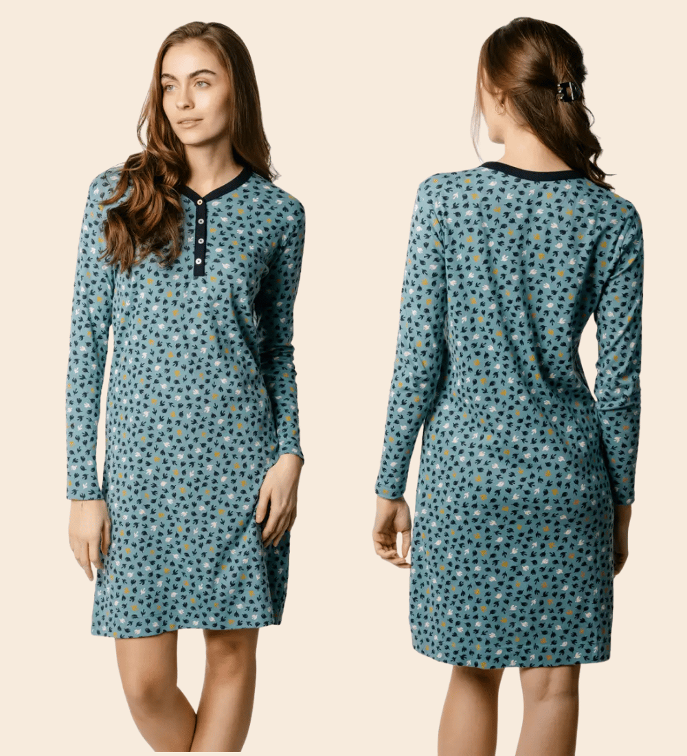 a woman in a teal patterned long sleeve knee length night shirt