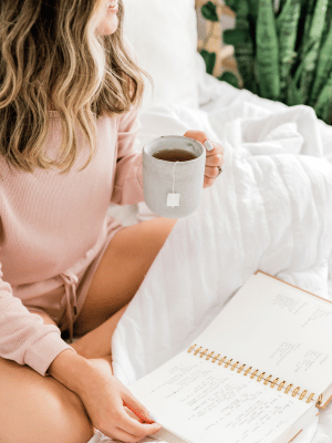 relax with tea in bed on organic cotton bedding