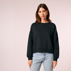 A woman wearing a black organic cotton sweatshirt